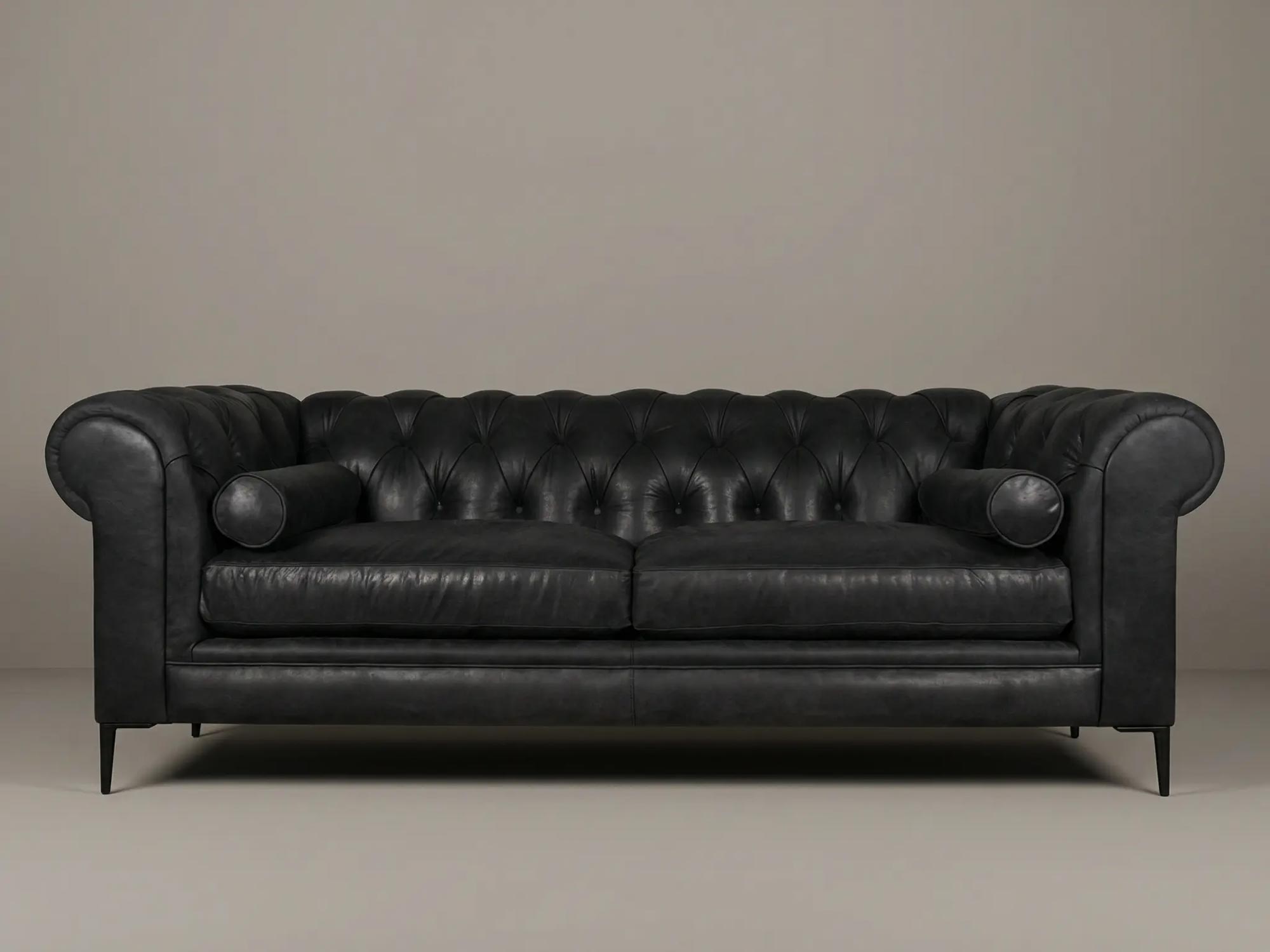 91 Eliza modern Chesterfield in Burnham Black with cushion seat, black aluminum legs, and bolster pillows