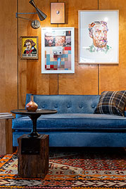 Ladybird sofa in Caprieze Denim Style blue leather with bench cushion and taper legs with sabots